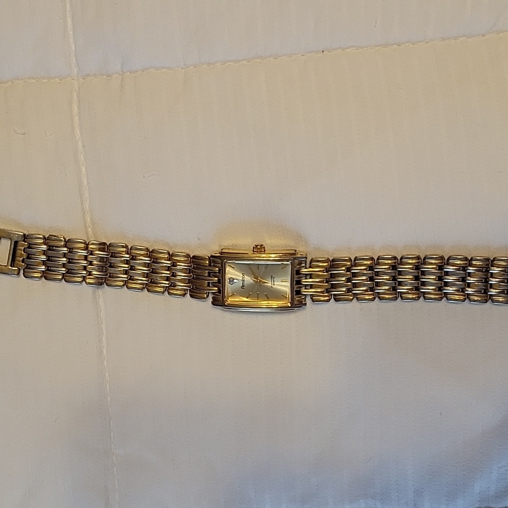 Ladies Armitron gold watch with diamond.
